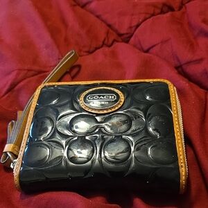 COACH BLACK AND TAN WALLET